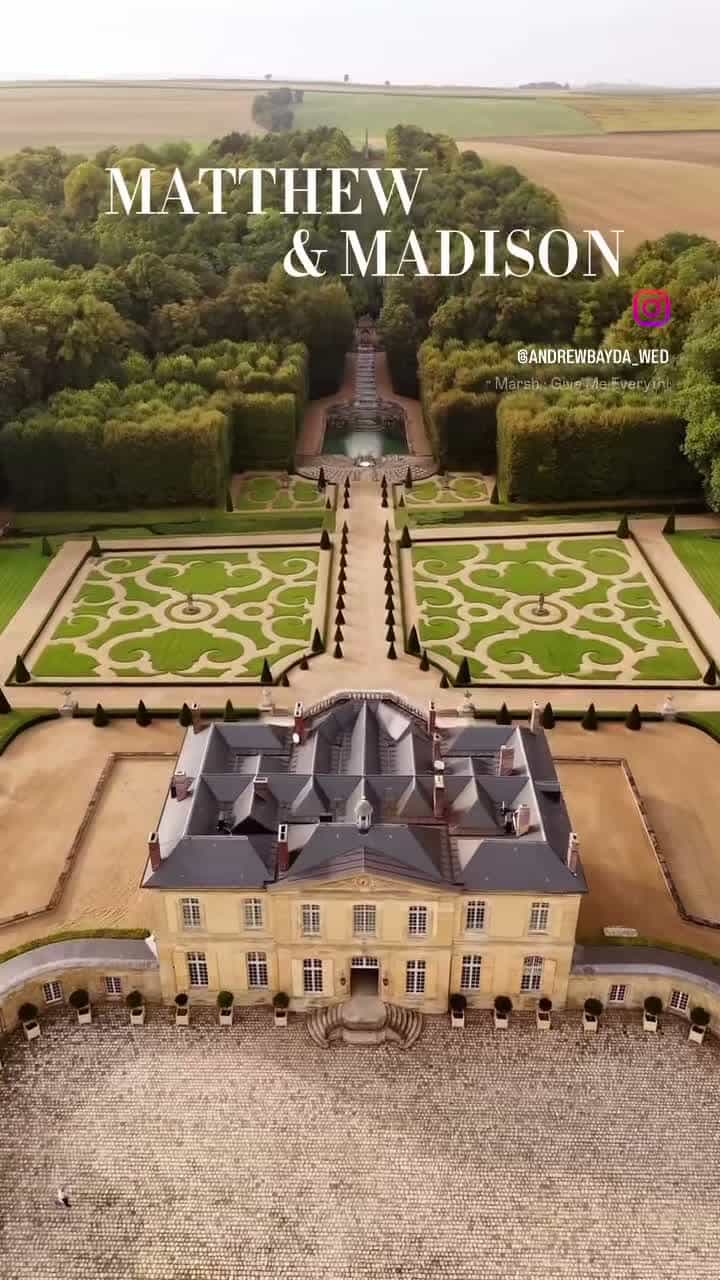 A bridal party gathered in a château bedroom before the ceremony